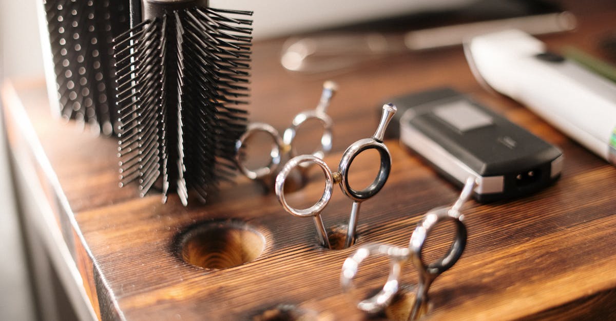 Close-up of barber tools on a stylish wooden counter, perfect for a salon setting.